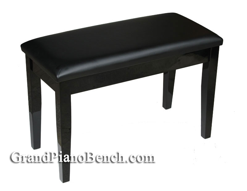 Polished black piano bench with padded top